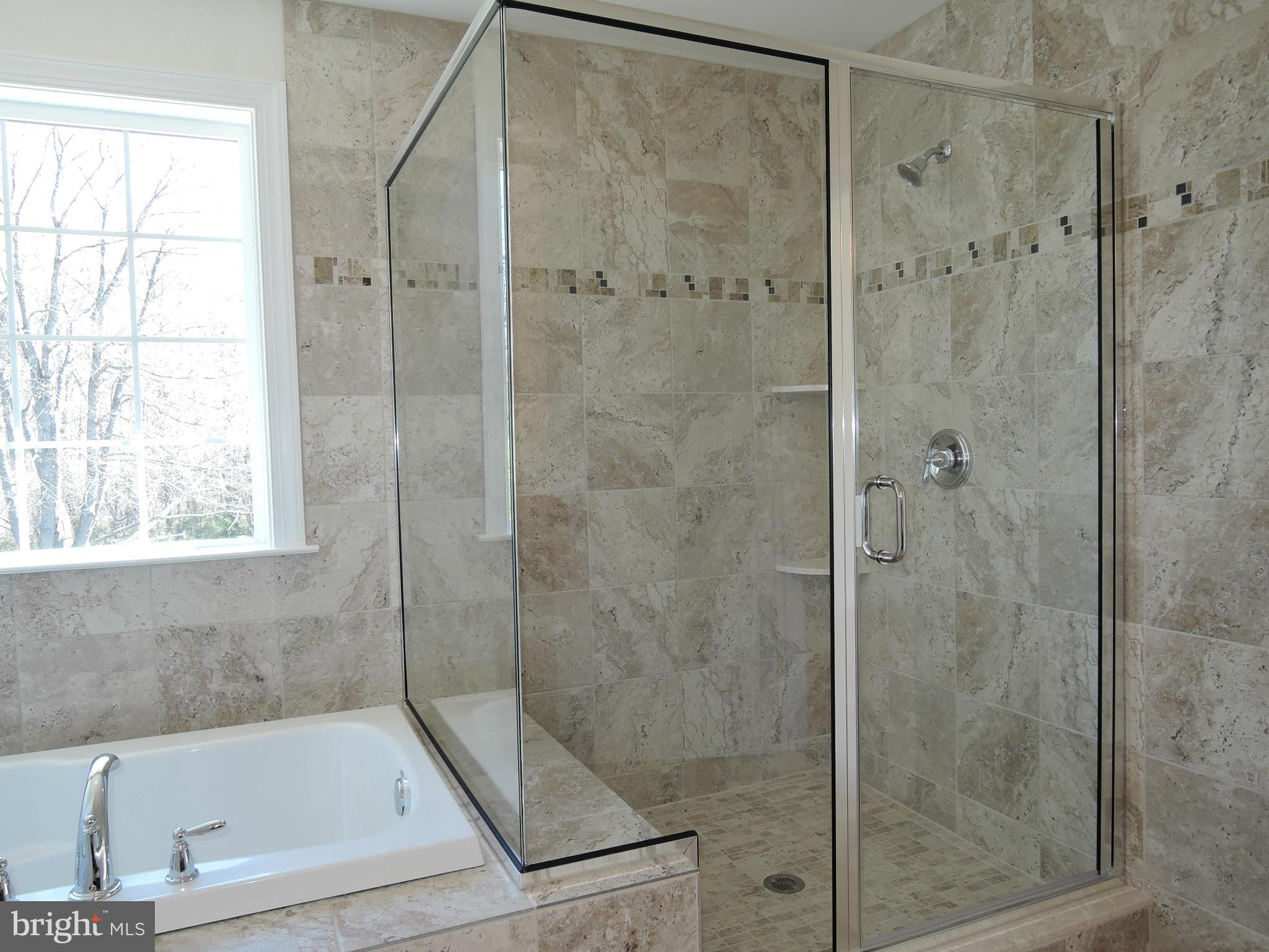 17023 Troyer Road Monkton, MD 21111 - Photo 18 of 30 a bathroom with a shower and a bathtub