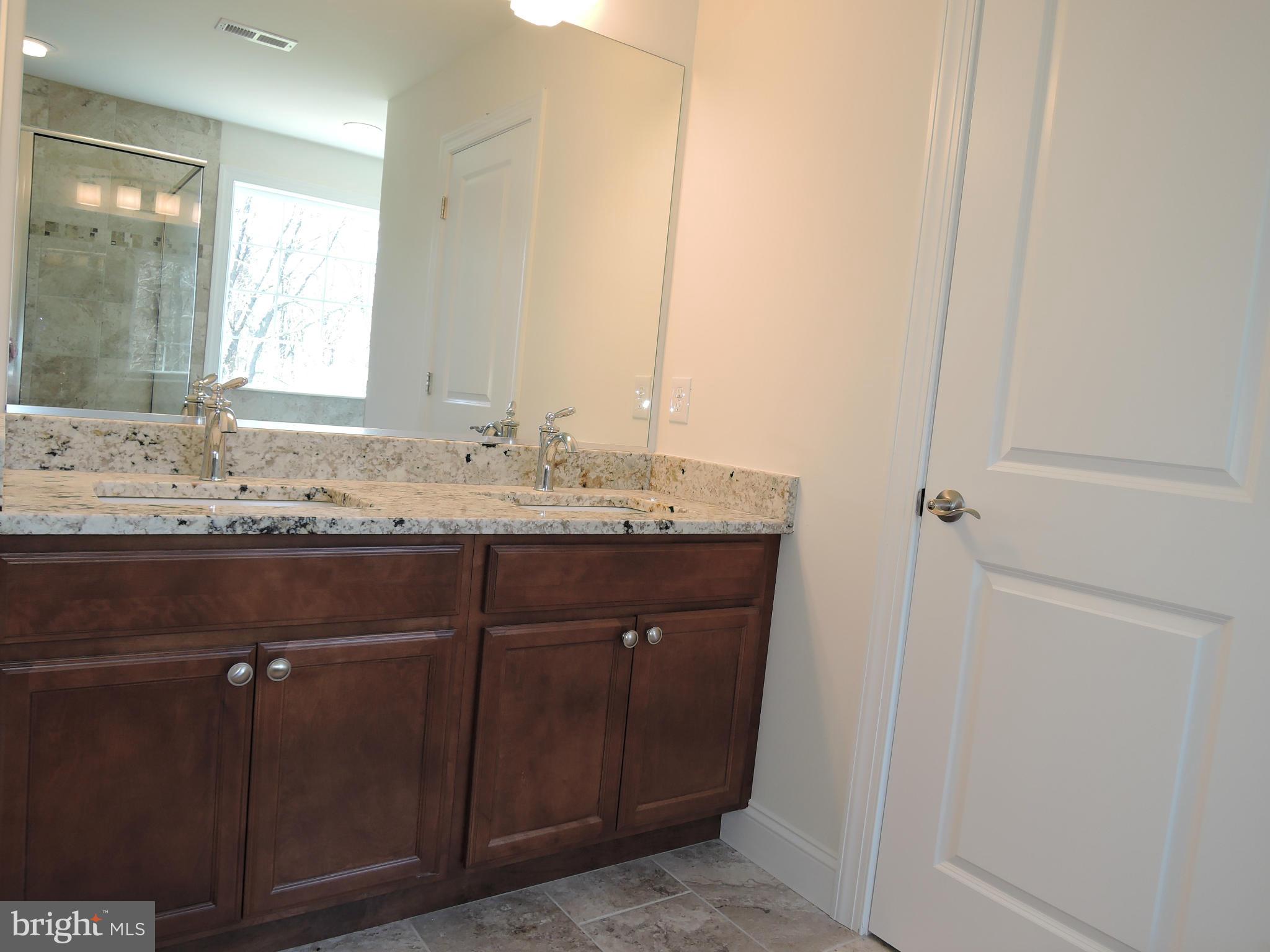 17023 Troyer Road Monkton, MD 21111 - Photo 19 of 30 a bathroom with a sink and a mirror