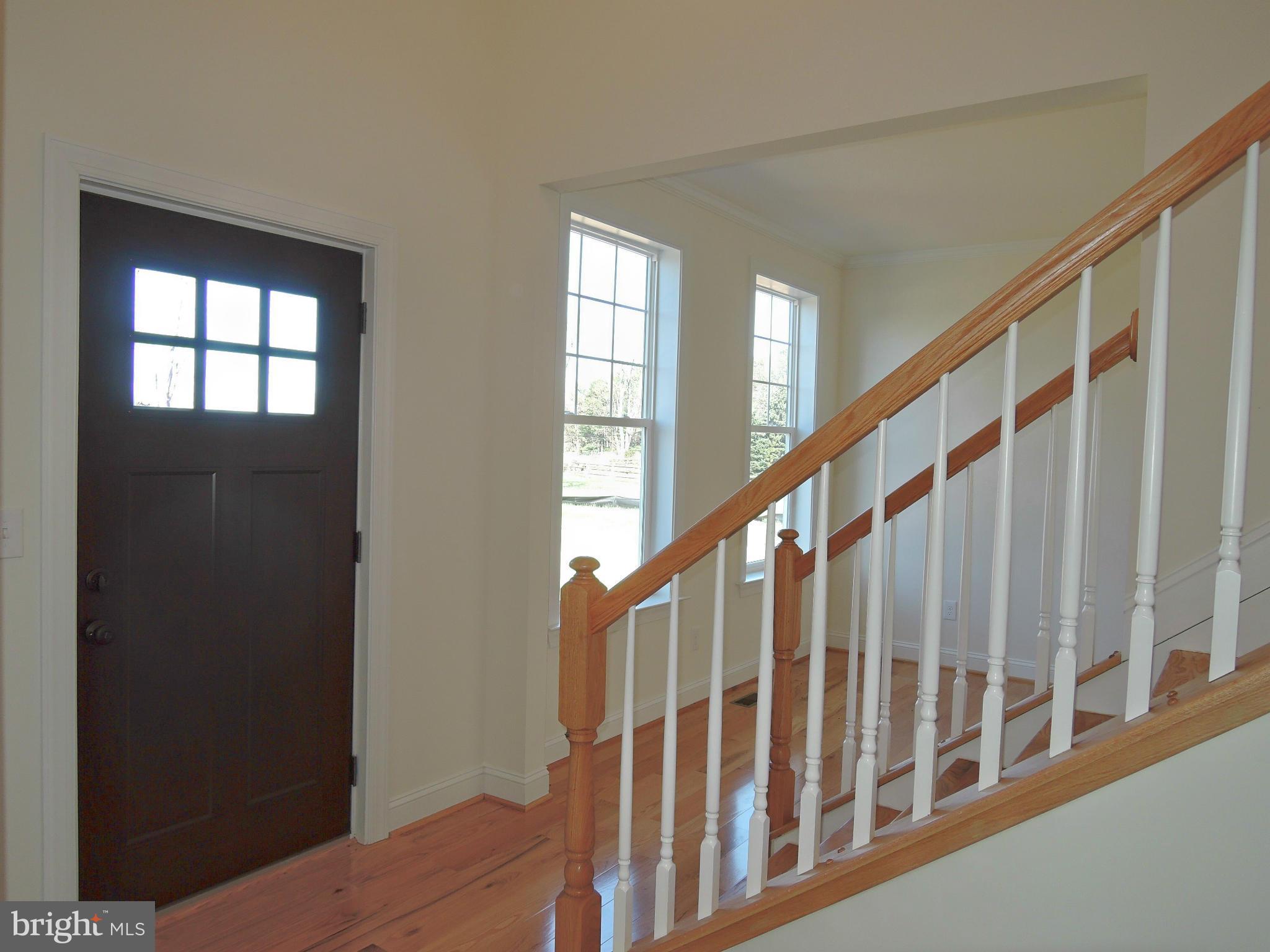 17023 Troyer Road Monkton, MD 21111 - Photo 3 of 30 a view of staircase with railing and a window
