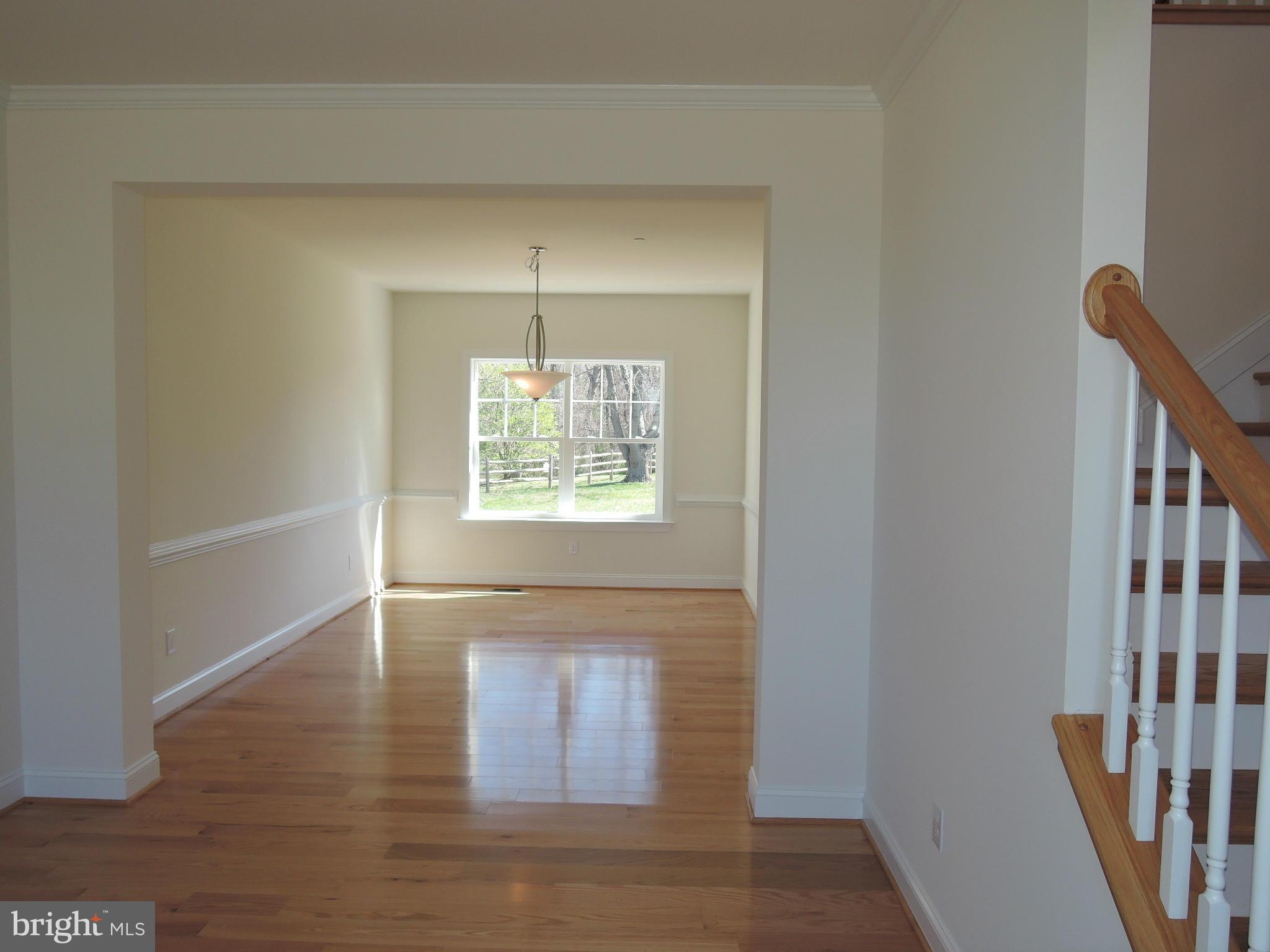 17023 Troyer Road Monkton, MD 21111 - Photo 5 of 30 wooden floor in an empty room with a window