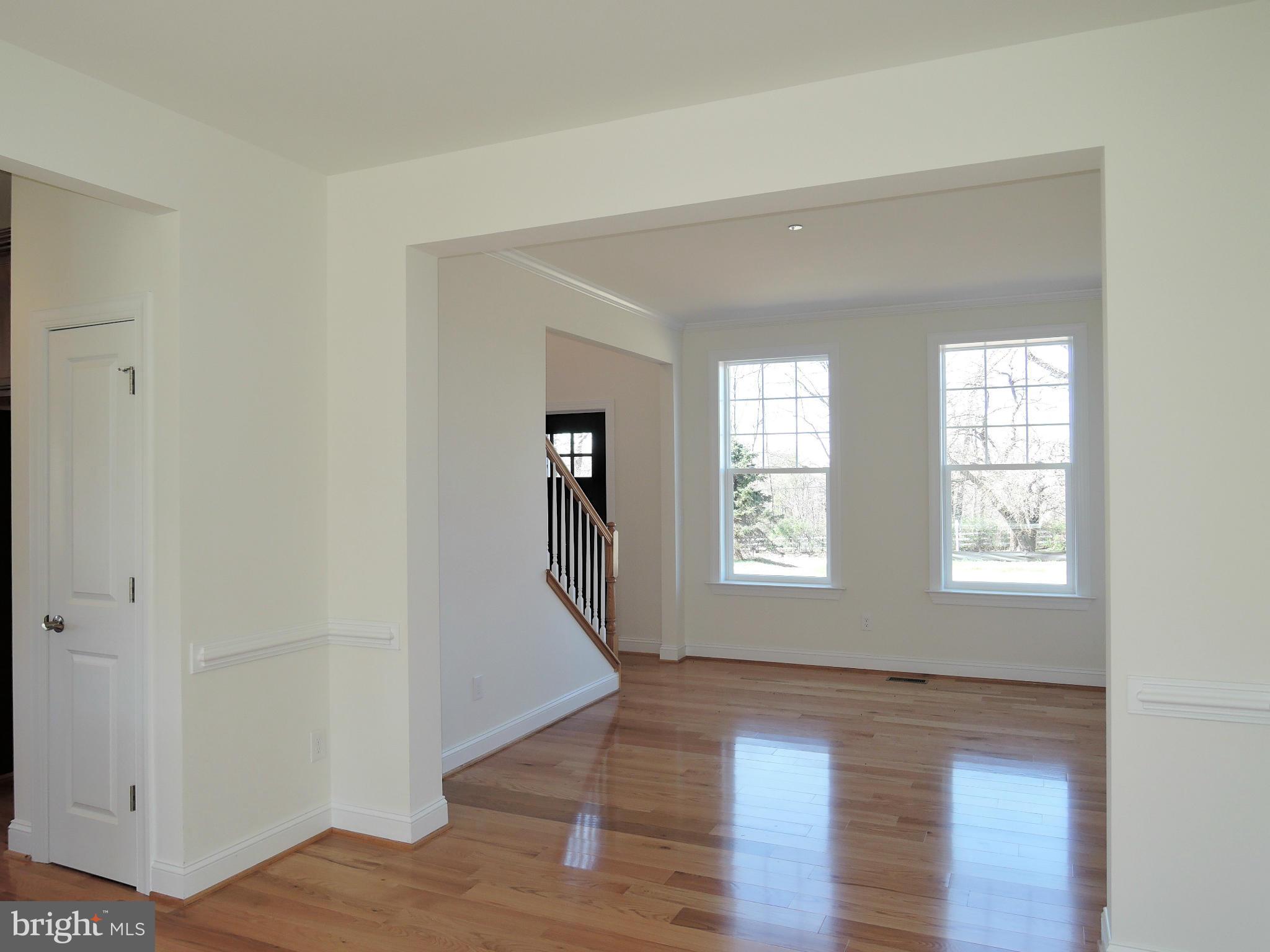 17023 Troyer Road Monkton, MD 21111 - Photo 6 of 30 a view of an empty room with wooden floor and a window