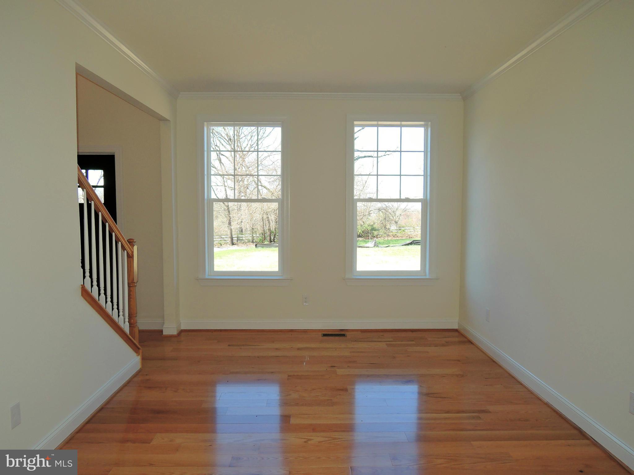 17023 Troyer Road Monkton, MD 21111 - Photo 8 of 30 a view of an empty room with wooden floor and a window
