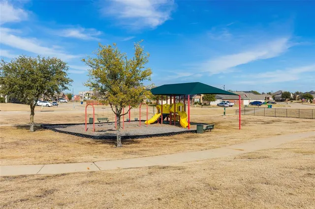a view of a swimming pool with an outdoor seating and a yard