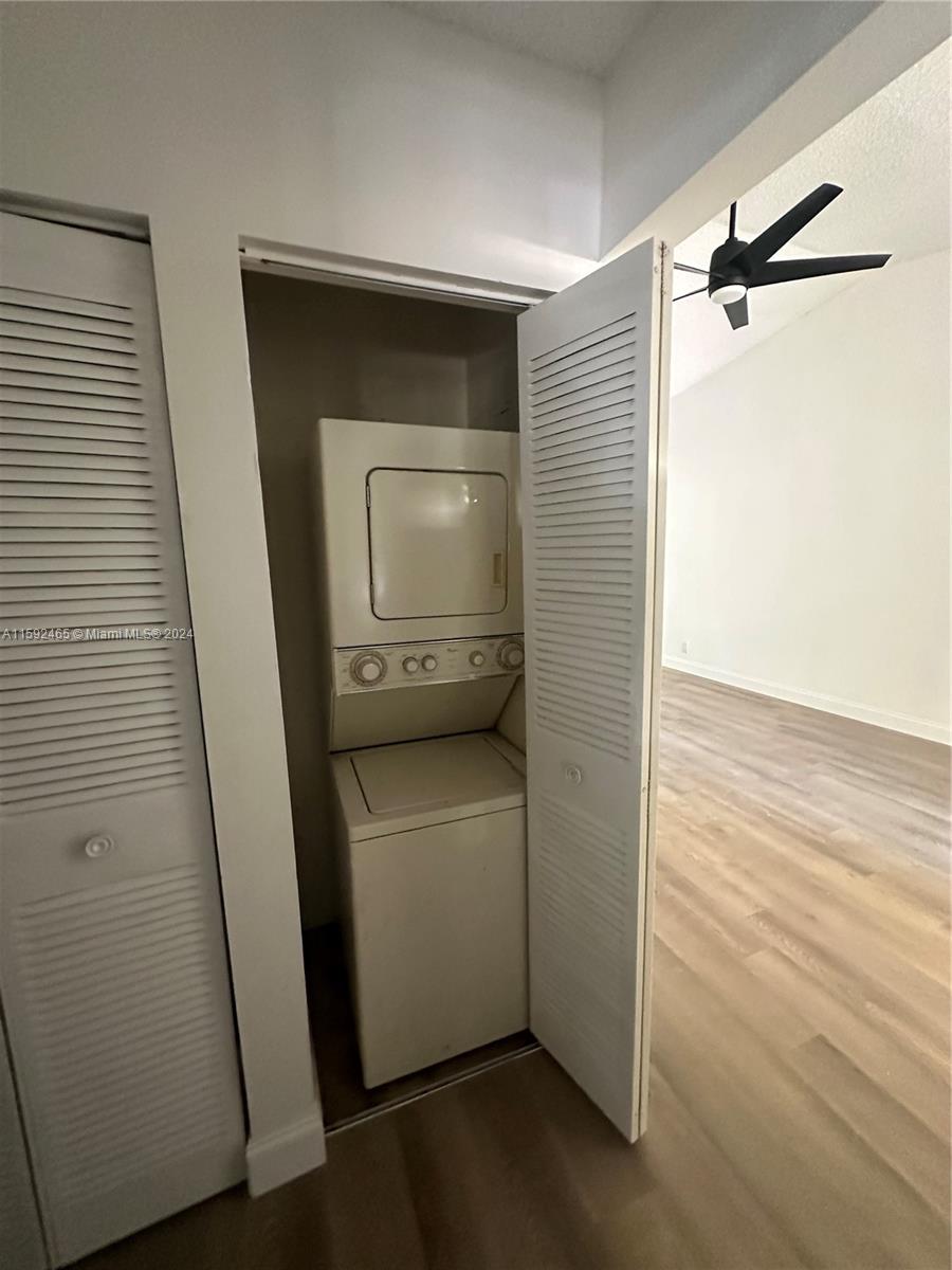 301 Olivewood Place, Unit O229 Boca Raton, FL 33431 - Photo 13 of 25 a utility room with a washer and dryer