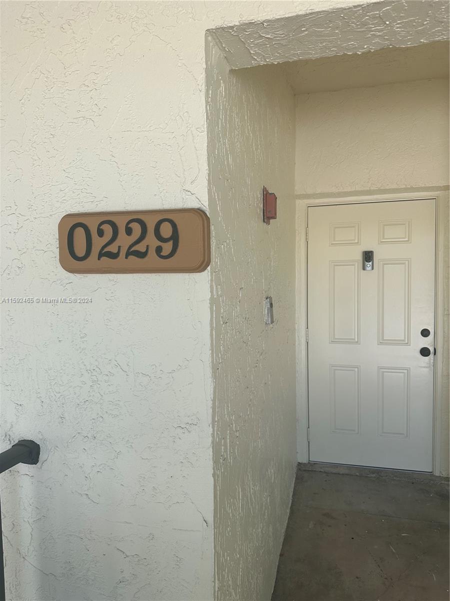 301 Olivewood Place, Unit O229 Boca Raton, FL 33431 - Photo 14 of 25 a view of a door and an entryway