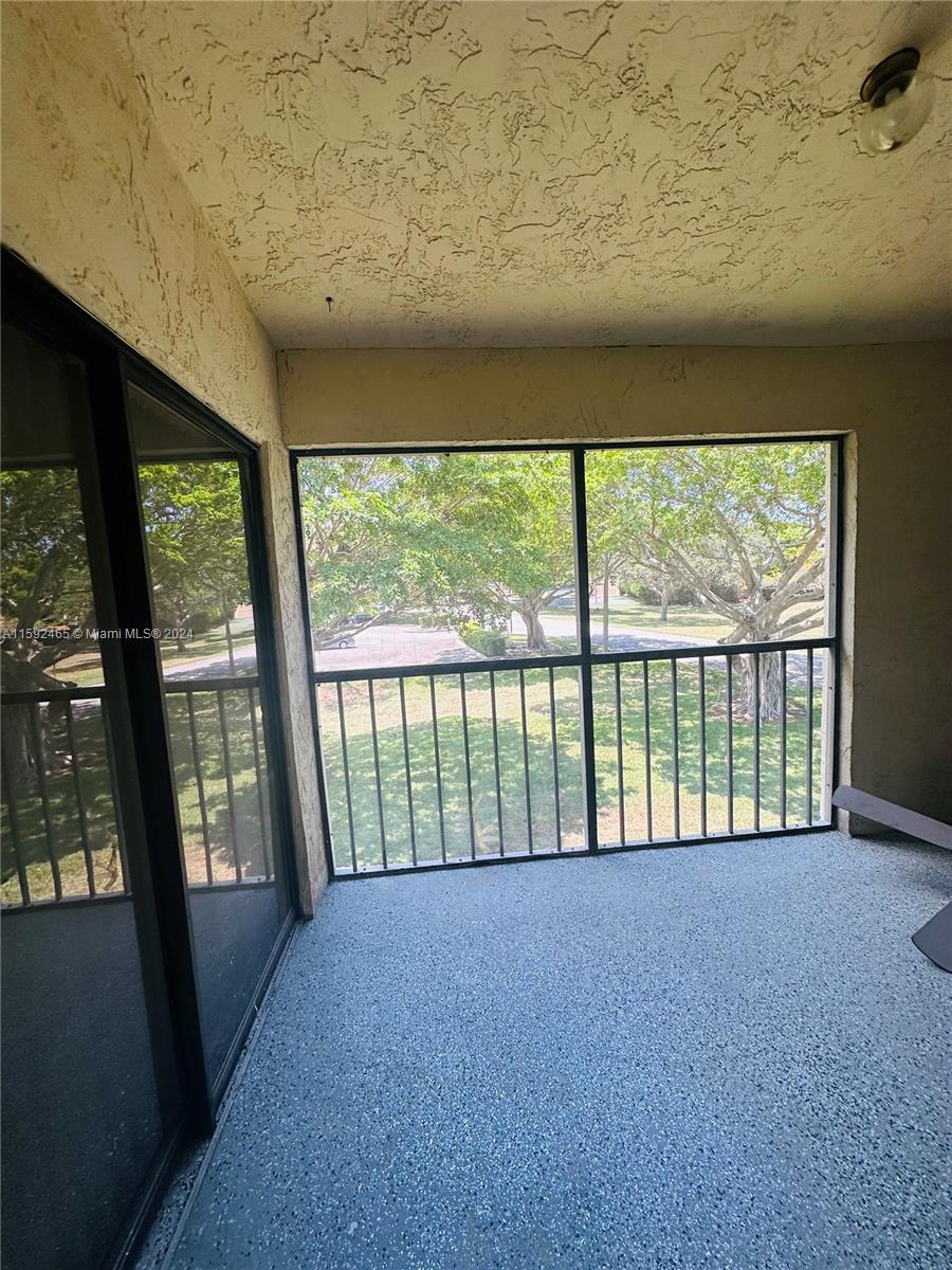 301 Olivewood Place, Unit O229 Boca Raton, FL 33431 - Photo 15 of 25 a view of a room with large windows