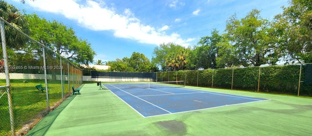 301 Olivewood Place, Unit O229 Boca Raton, FL 33431 - Photo 18 of 25 a view of a tennis court