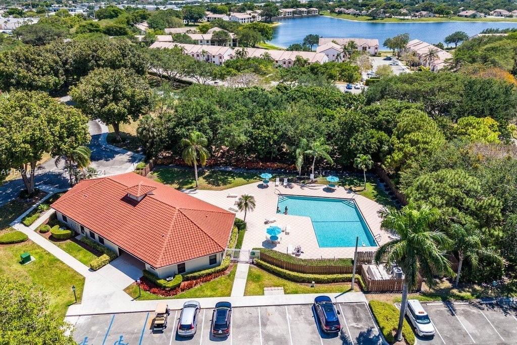 301 Olivewood Place, Unit O229 Boca Raton, FL 33431 - Photo 22 of 25 an aerial view of a house with swimming pool and lake view