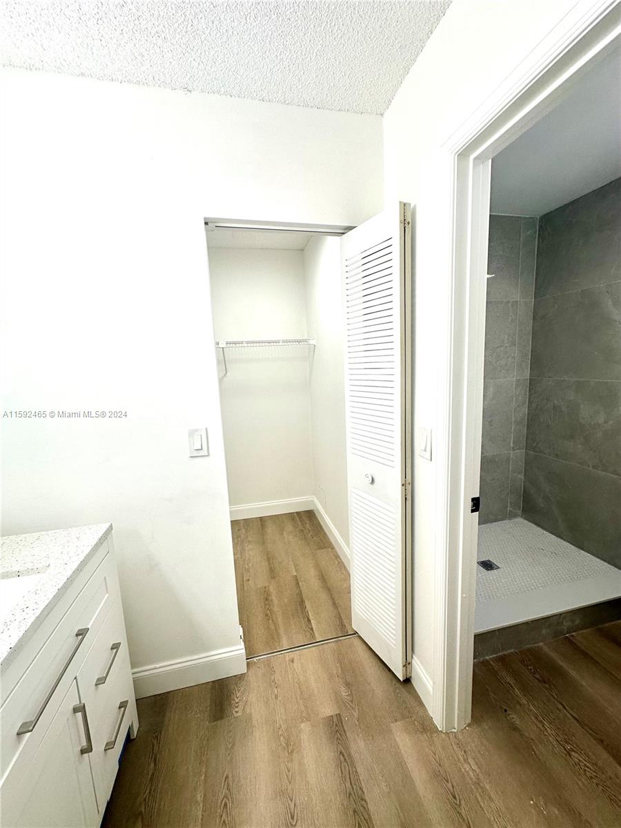 301 Olivewood Place, Unit O229 Boca Raton, FL 33431 - Photo 8 of 25 a bathroom with a sink and a mirror