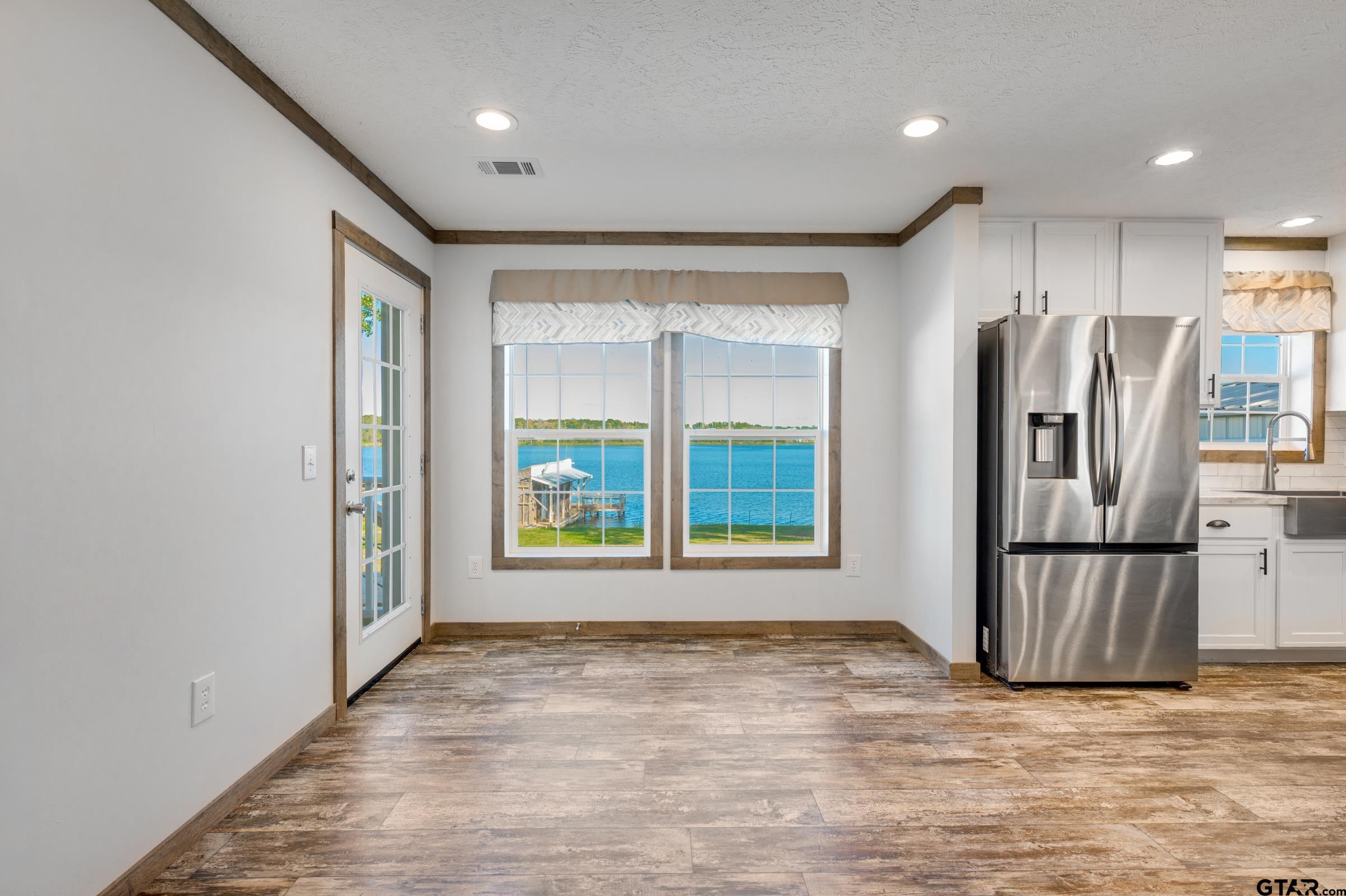 21903 Boles Road Frankston, TX 75763 - Photo 16 of 48 a view of kitchen with stainless steel appliances granite countertop a refrigerator and a sink
