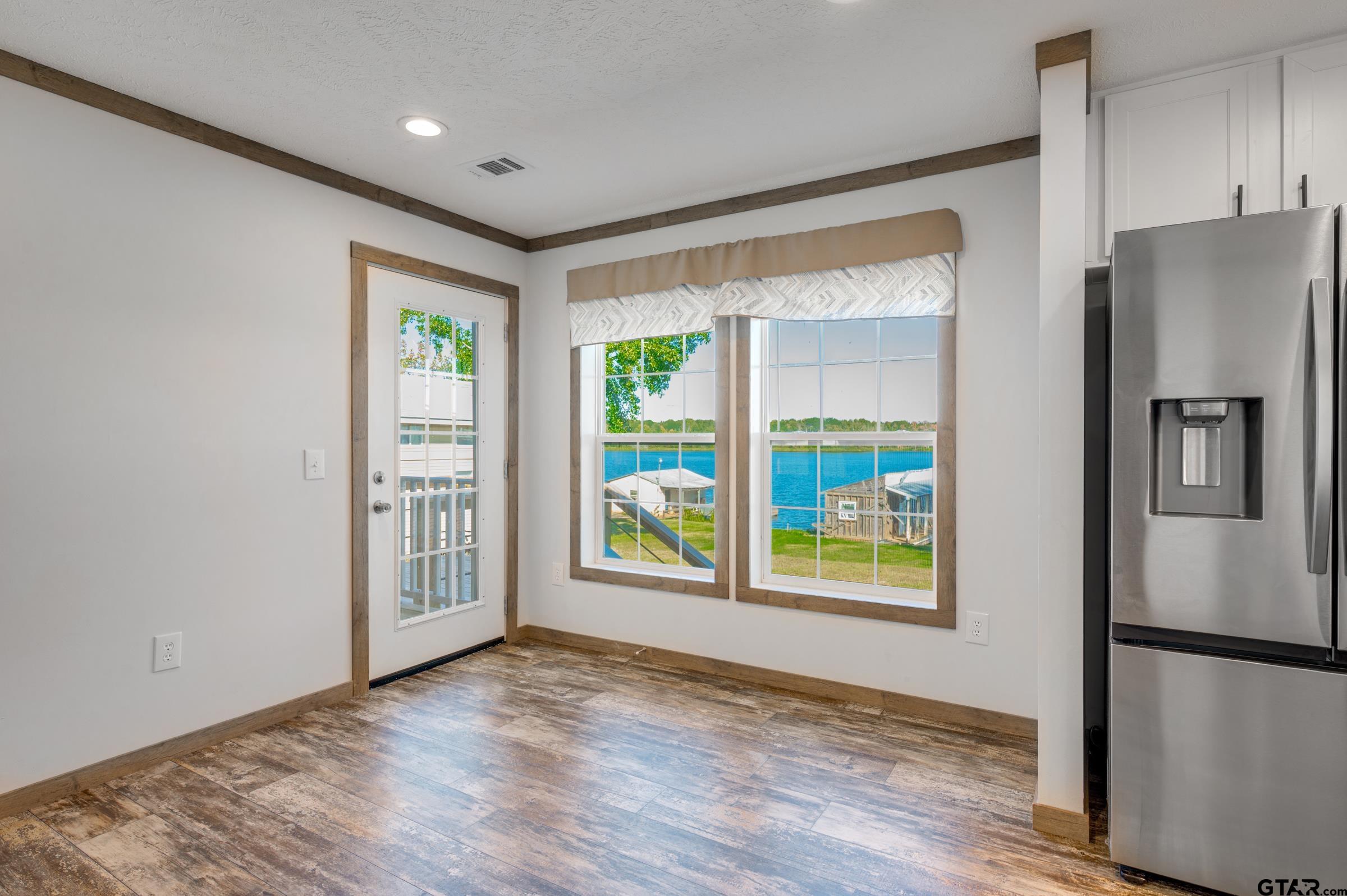 21903 Boles Road Frankston, TX 75763 - Photo 17 of 48 a view of an empty room with window and refrigerator