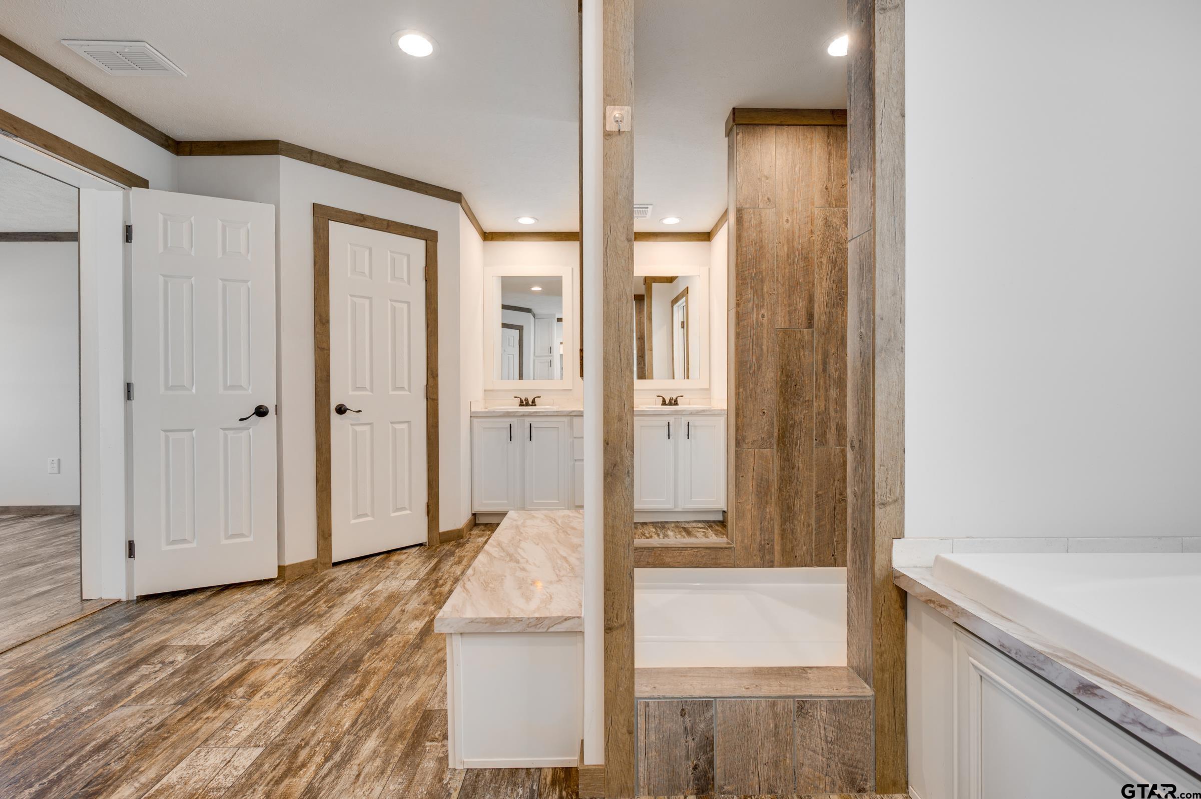 21903 Boles Road Frankston, TX 75763 - Photo 24 of 48 a view of a hallway with wooden floor and staircase
