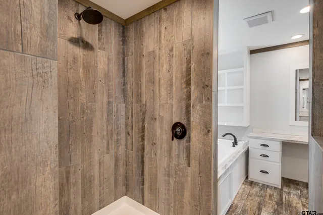 a bathroom with a shower curtain and a sink