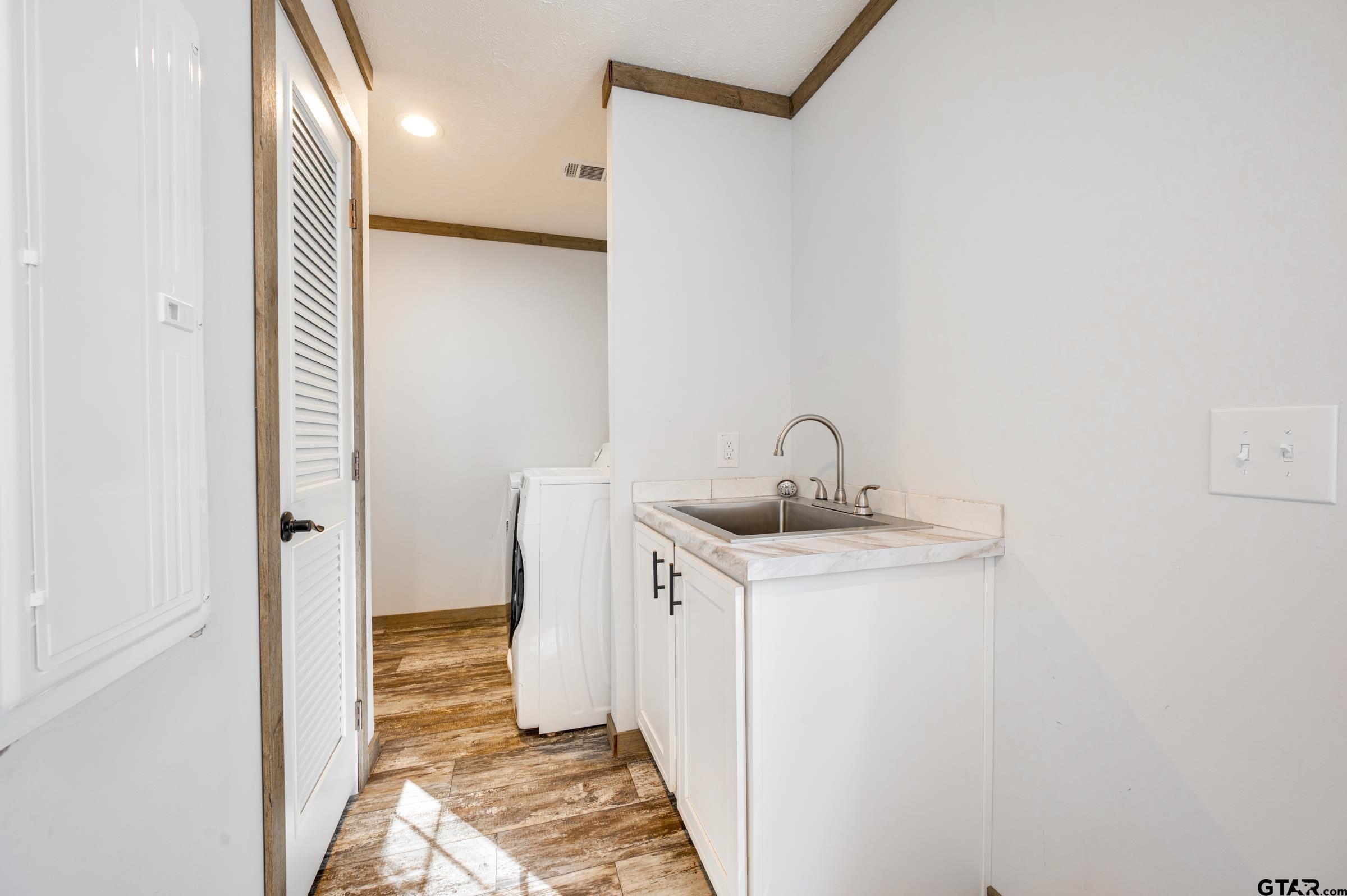 21903 Boles Road Frankston, TX 75763 - Photo 31 of 48 a bathroom with a sink and a mirror