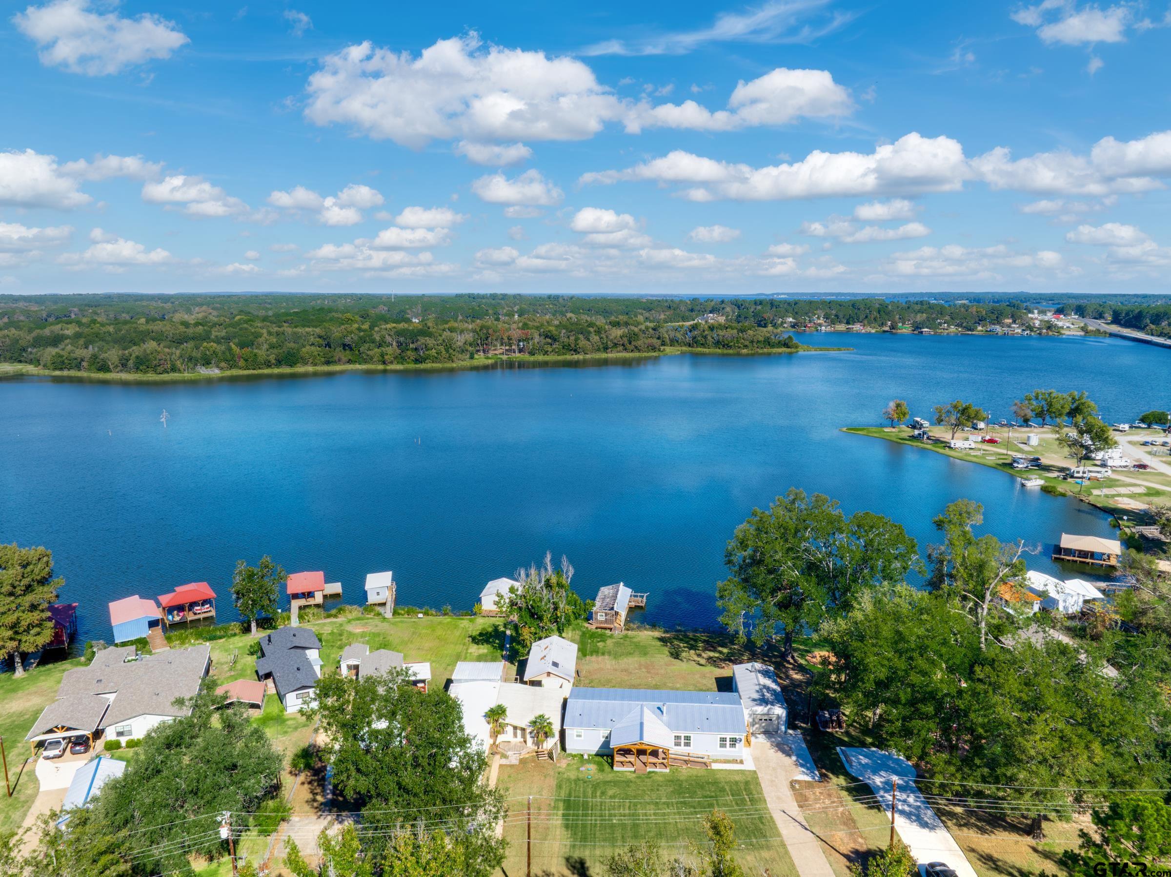 21903 Boles Road Frankston, TX 75763 - Photo 45 of 48 a view of a lake with a houses