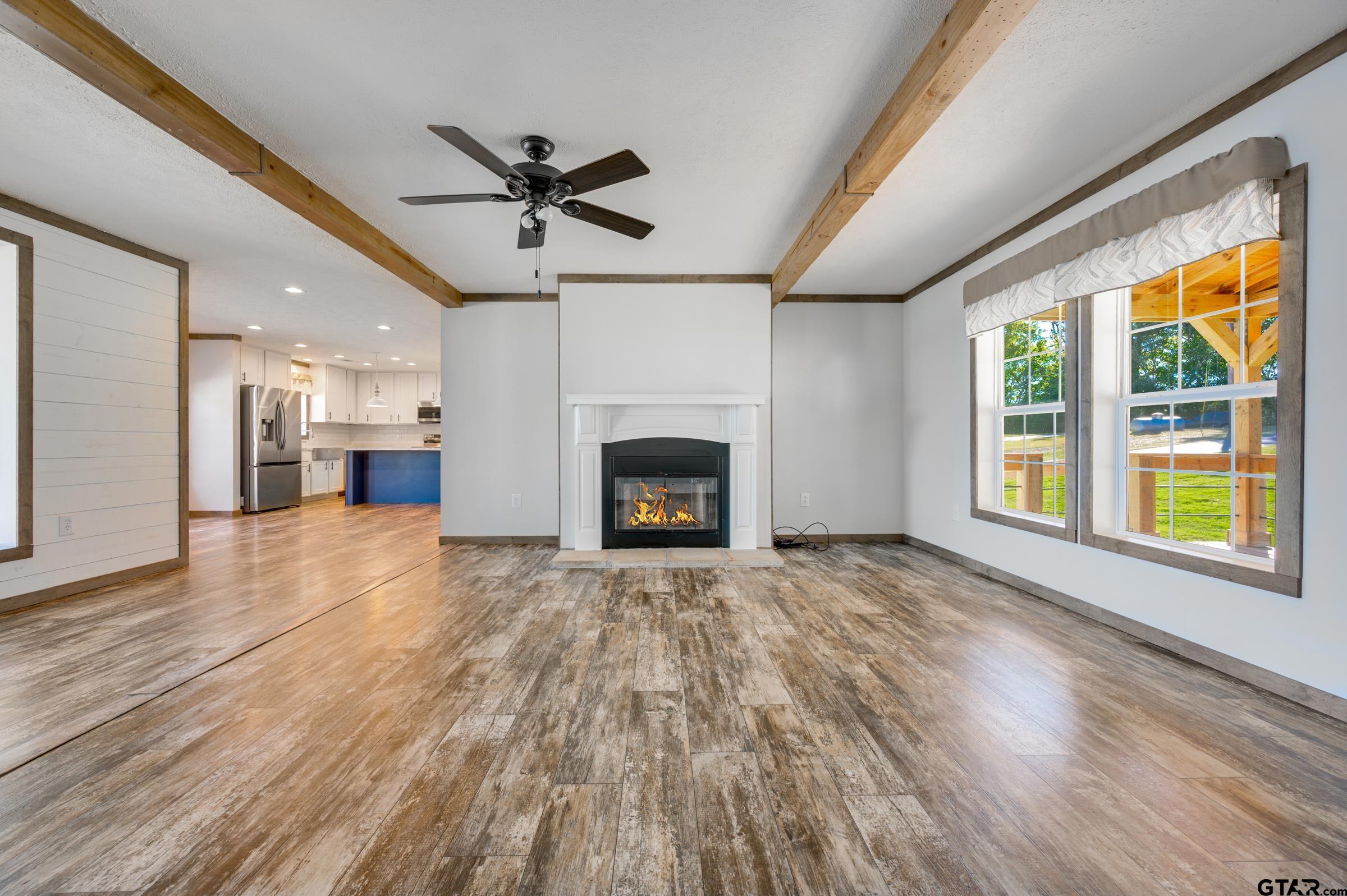21903 Boles Road Frankston, TX 75763 - Photo 6 of 48 a view of empty room with wooden floor and a window