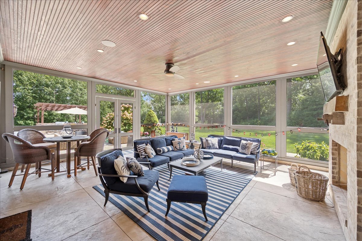 24 Bridlewood Road Northbrook, IL 60062 - Photo 24 of 56 a living room with furniture and a floor to ceiling window