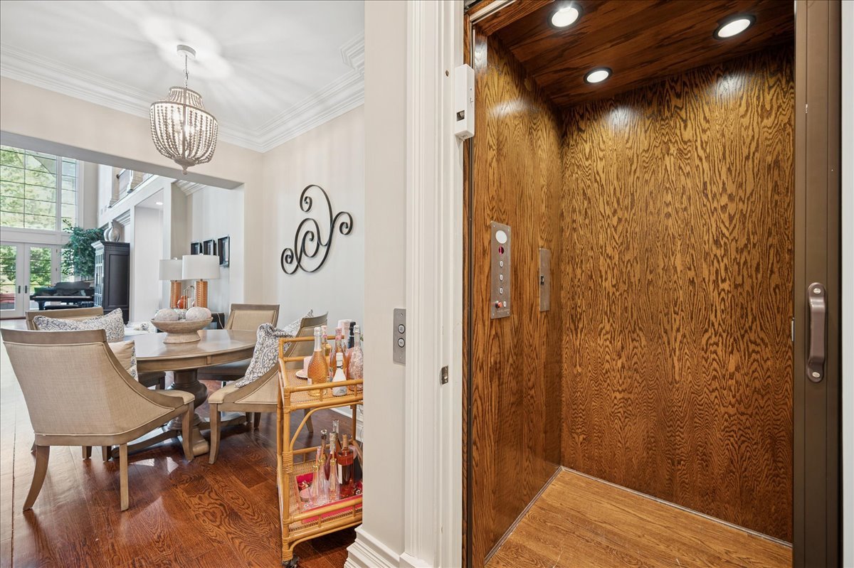 24 Bridlewood Road Northbrook, IL 60062 - Photo 44 of 56 a view of a dining room with furniture and a chandelier