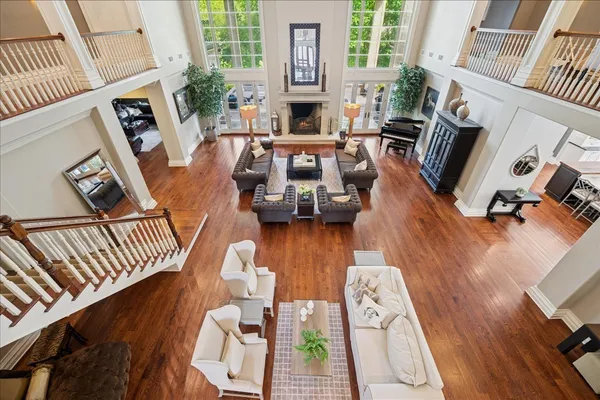 a living room with furniture fireplace and flat screen tv