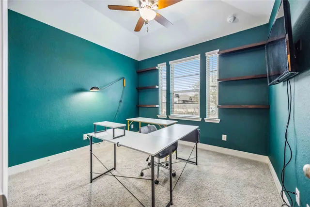 a workspace with furniture and a window