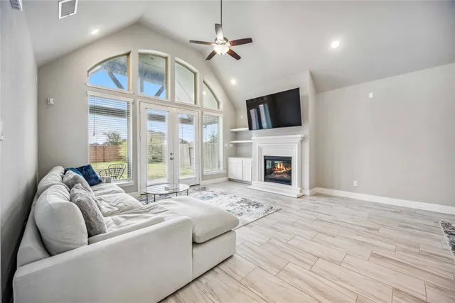 a living room with furniture fireplace and flat screen tv