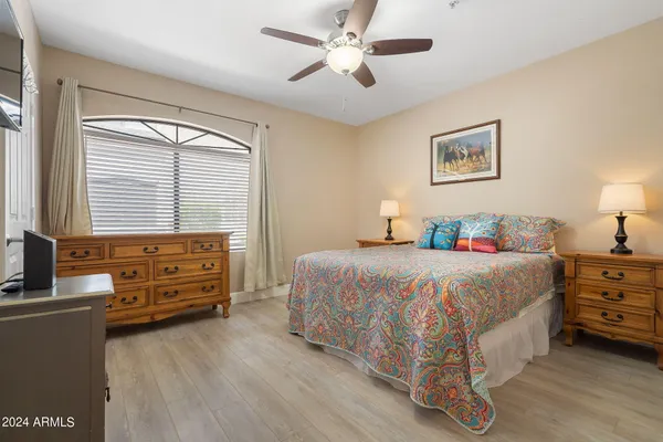 a bedroom with a bed and a dresser