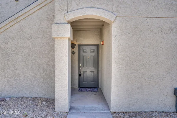 a view of a storage & utility room with a door
