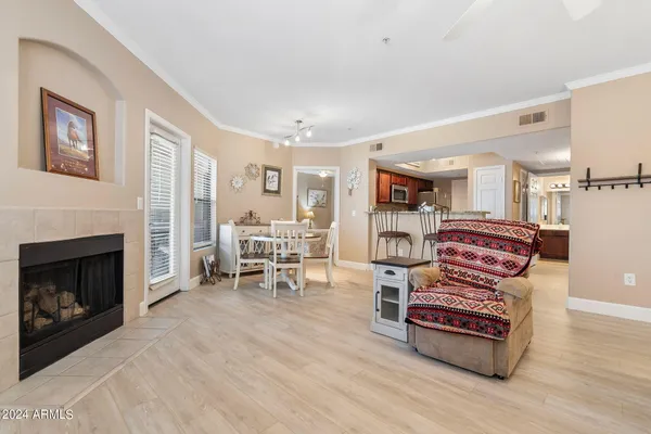 a living room with furniture and a fireplace