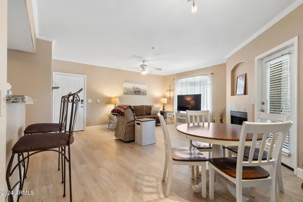 a dining room with furniture and window