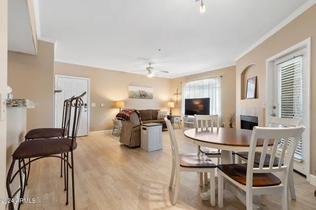 a dining room with furniture and window