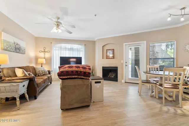 a living room with furniture and fireplace