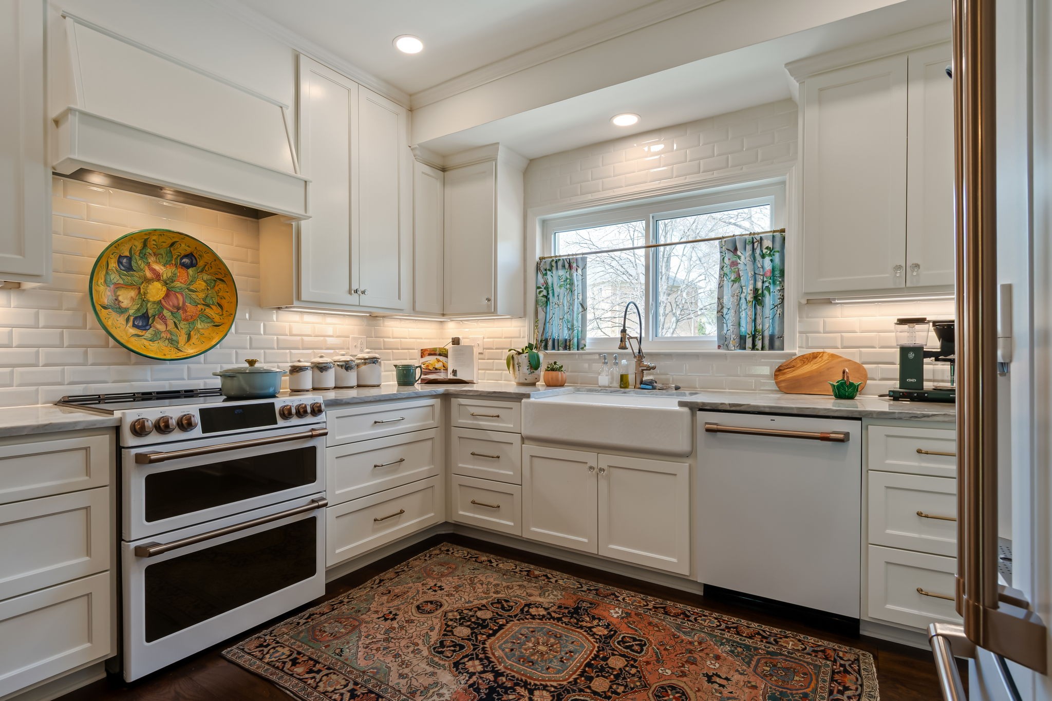 4487 Post Place, Unit 12 Nashville, TN 37205 - Photo 19 of 39 a kitchen with a stove a sink and a window