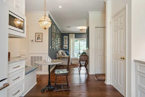 a living room with furniture fireplace and rug