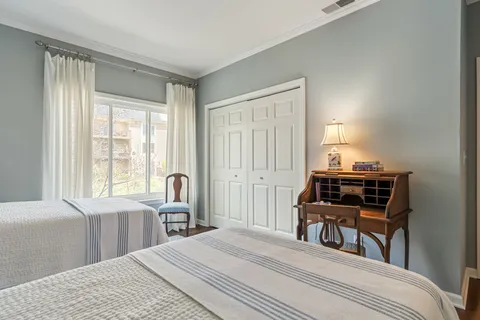 a bed room with a bed and a window