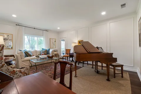 a living room with furniture a window and a table