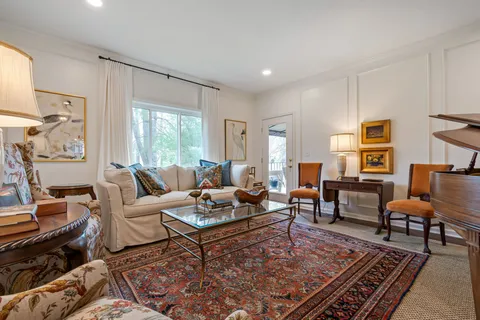 a living room with furniture and a rug