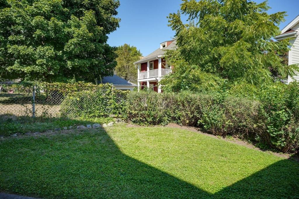 13-15 Appleton Terrace Watertown, MA 02472 - Photo 2 of 10 a view of a backyard with plants and a garden