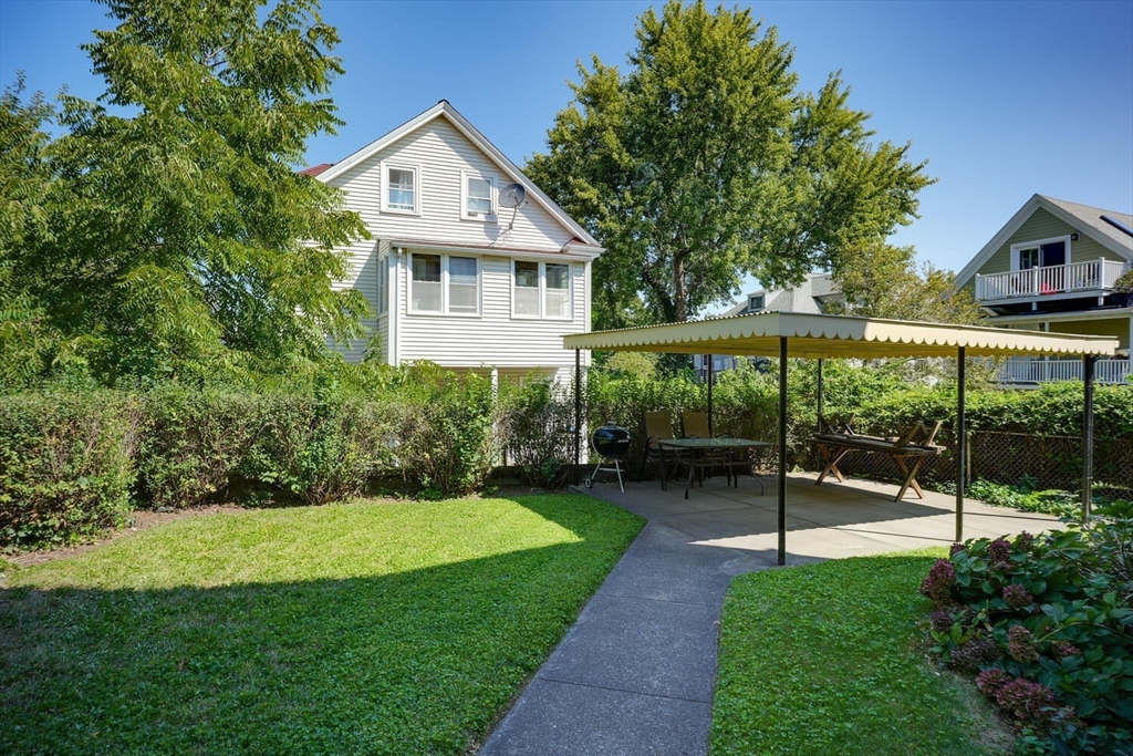 13-15 Appleton Terrace Watertown, MA 02472 - Photo 3 of 10 a view of a house with a backyard
