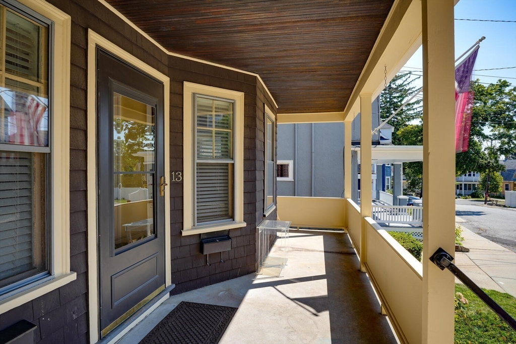 13-15 Appleton Terrace Watertown, MA 02472 - Photo 4 of 10 a front view of a house with outdoor space