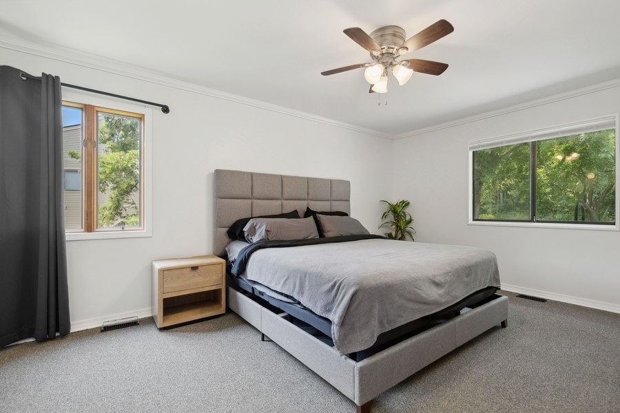 21 Mineola Road Fox Lake, IL 60020 - Photo 14 of 21 a bed sitting in a bedroom next to a window