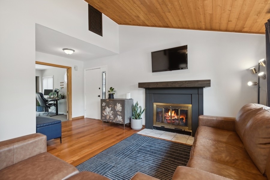 21 Mineola Road Fox Lake, IL 60020 - Photo 6 of 21 a living room with furniture and a fireplace