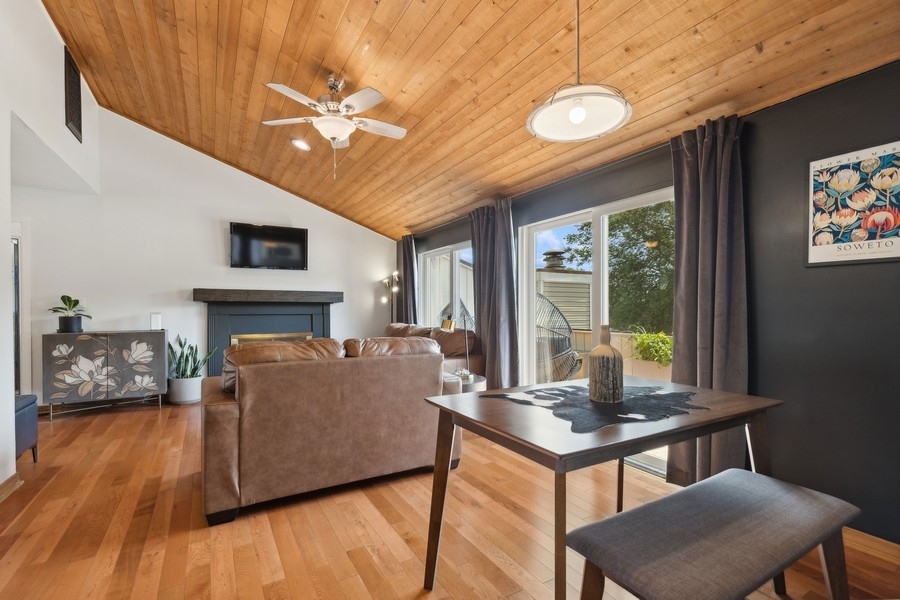 21 Mineola Road Fox Lake, IL 60020 - Photo 8 of 21 a living room with furniture a fireplace and a flat screen tv