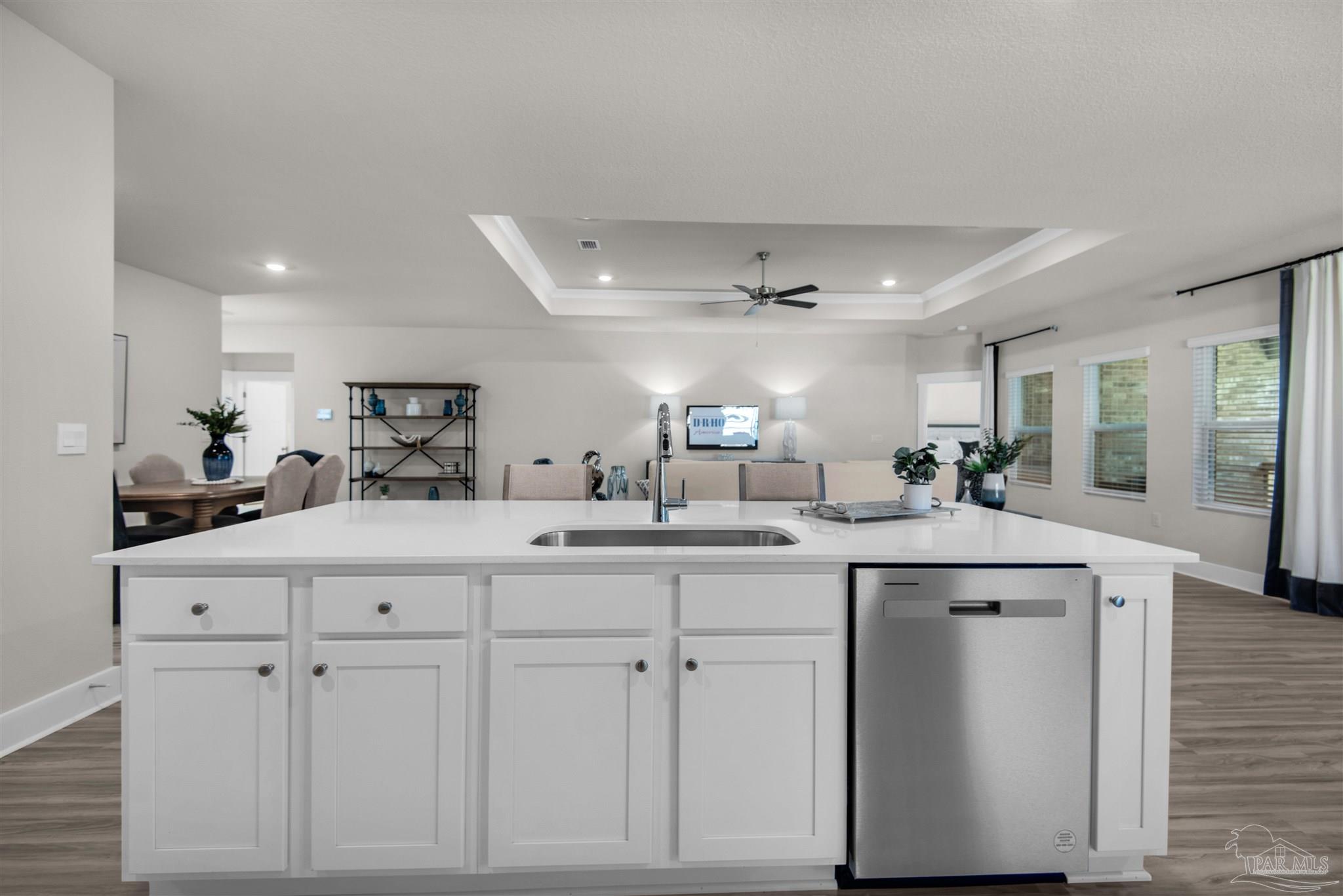 3287 Water Birch Road Cantonment, FL 32533 - Photo 27 of 45 a kitchen with white cabinets and sink