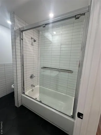 a bathroom with a shower and a bathtub