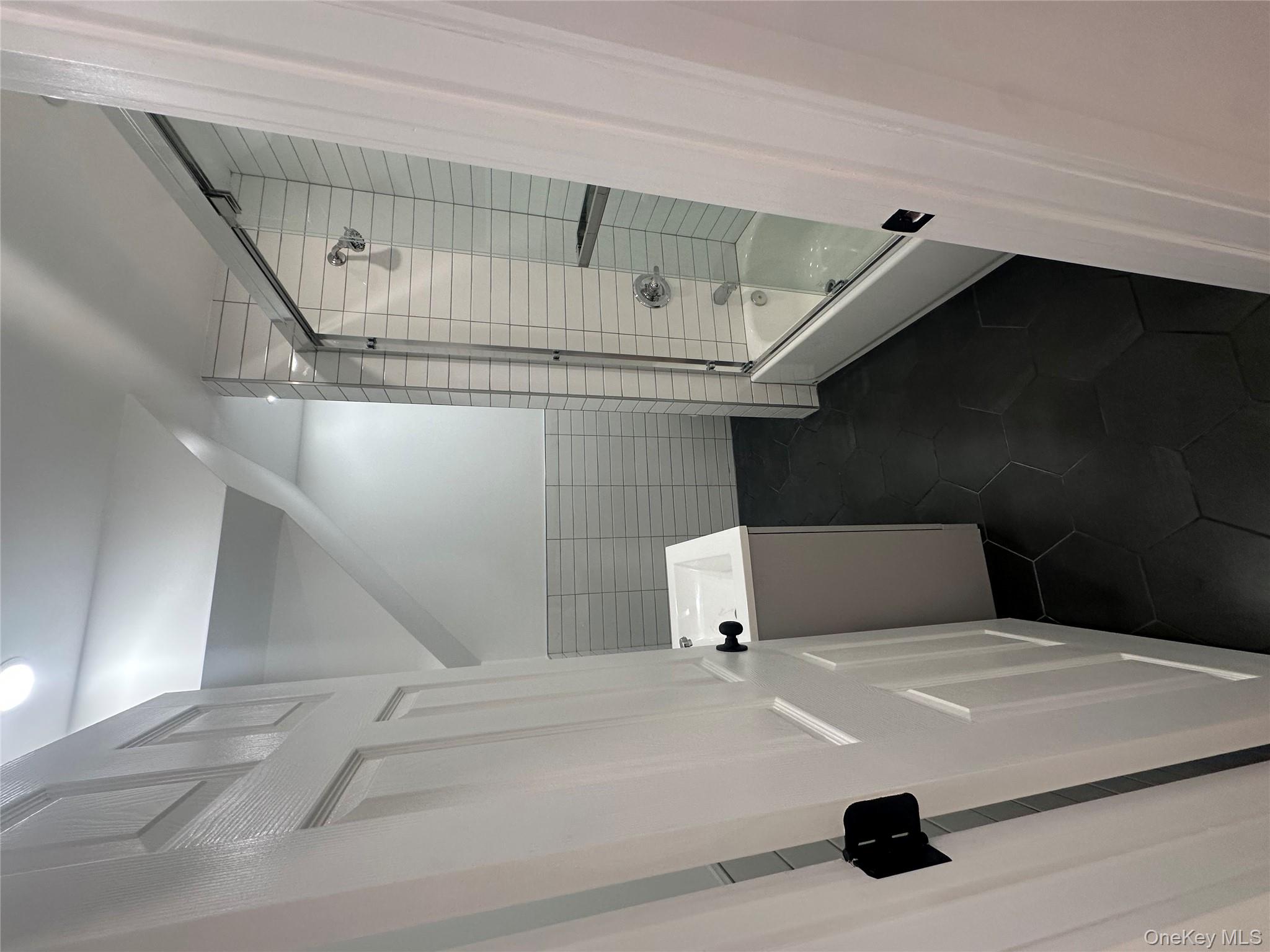 Undisclosed Address Queens, NY 11416 - Photo 9 of 10 a bathroom with a shower