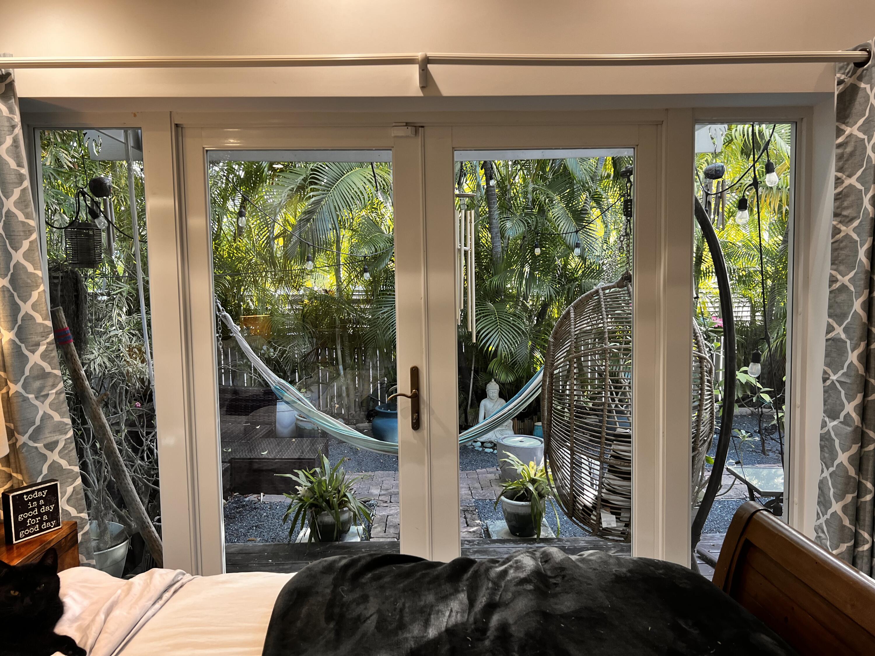 1421 Reynolds Street Key West, FL 33040 - Photo 16 of 45 a living room with furniture and a large window