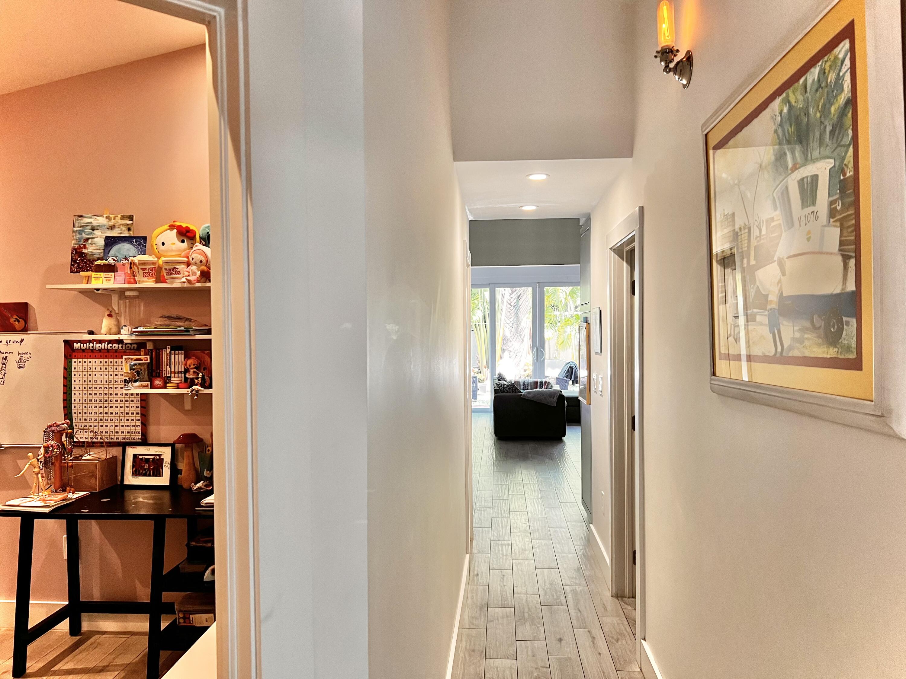 1421 Reynolds Street Key West, FL 33040 - Photo 23 of 45 a view of a hallway and a livingroom with furniture