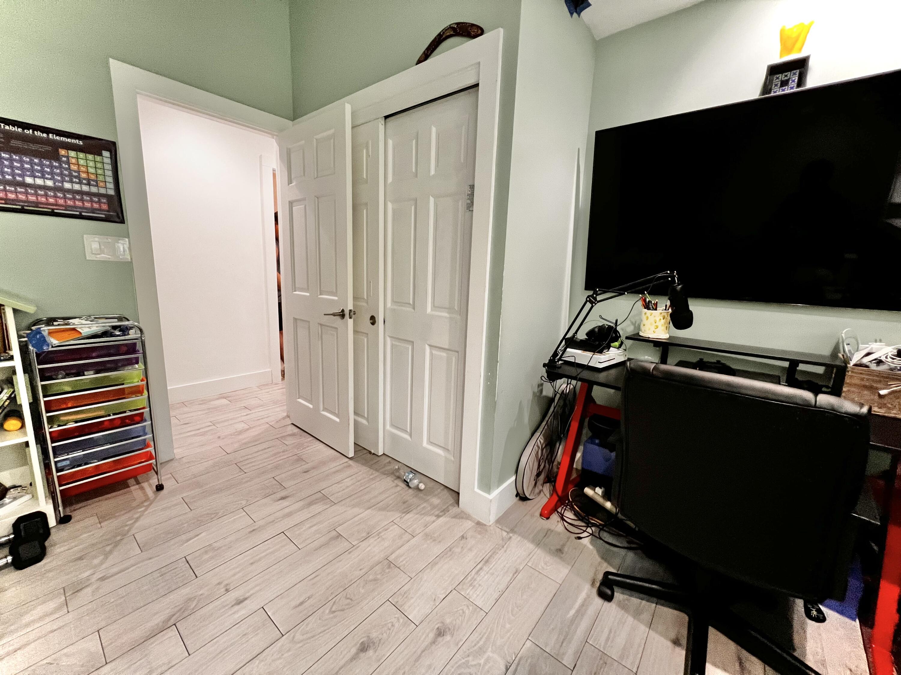 1421 Reynolds Street Key West, FL 33040 - Photo 28 of 45 a room with furniture and a flat screen tv