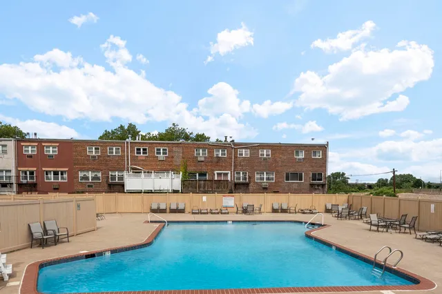 a view of a swimming pool with a lounge chairs