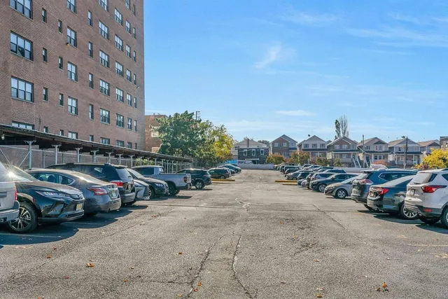 a view of a cars parked in front of a building